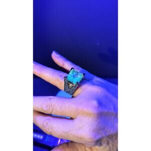 704  Glowy Ring with blue stones, silver metal finish